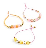 1241 Perlas alfabeto doradas